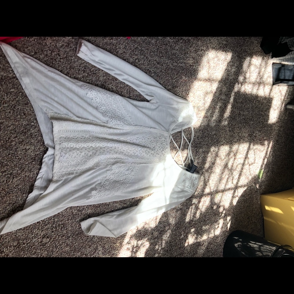 flowy white quarter sleeve shirt.